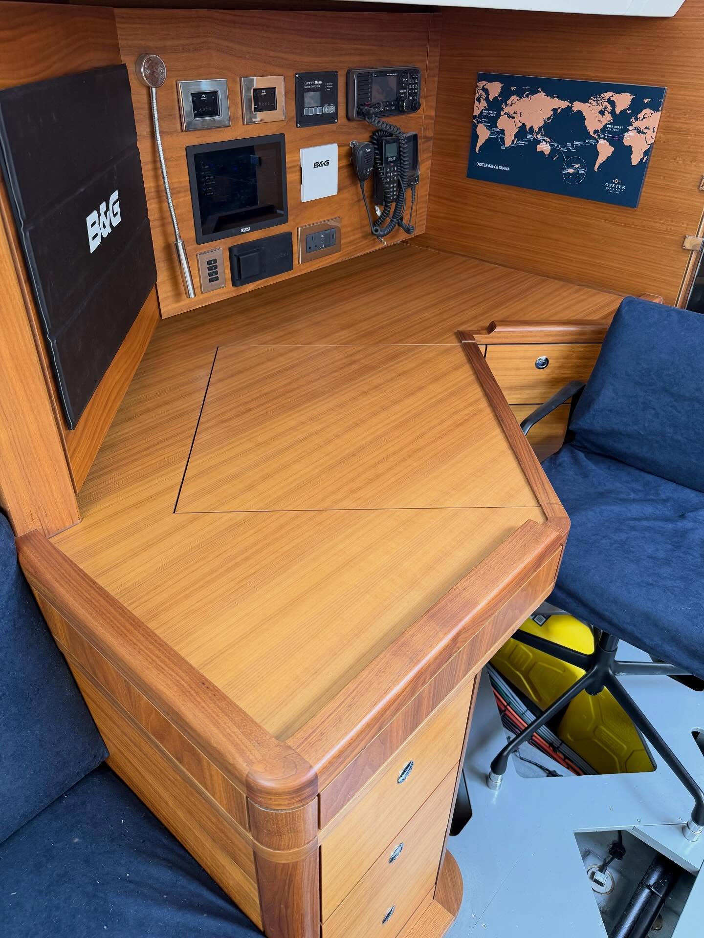 Restored timber chart table inside a sailing yacht