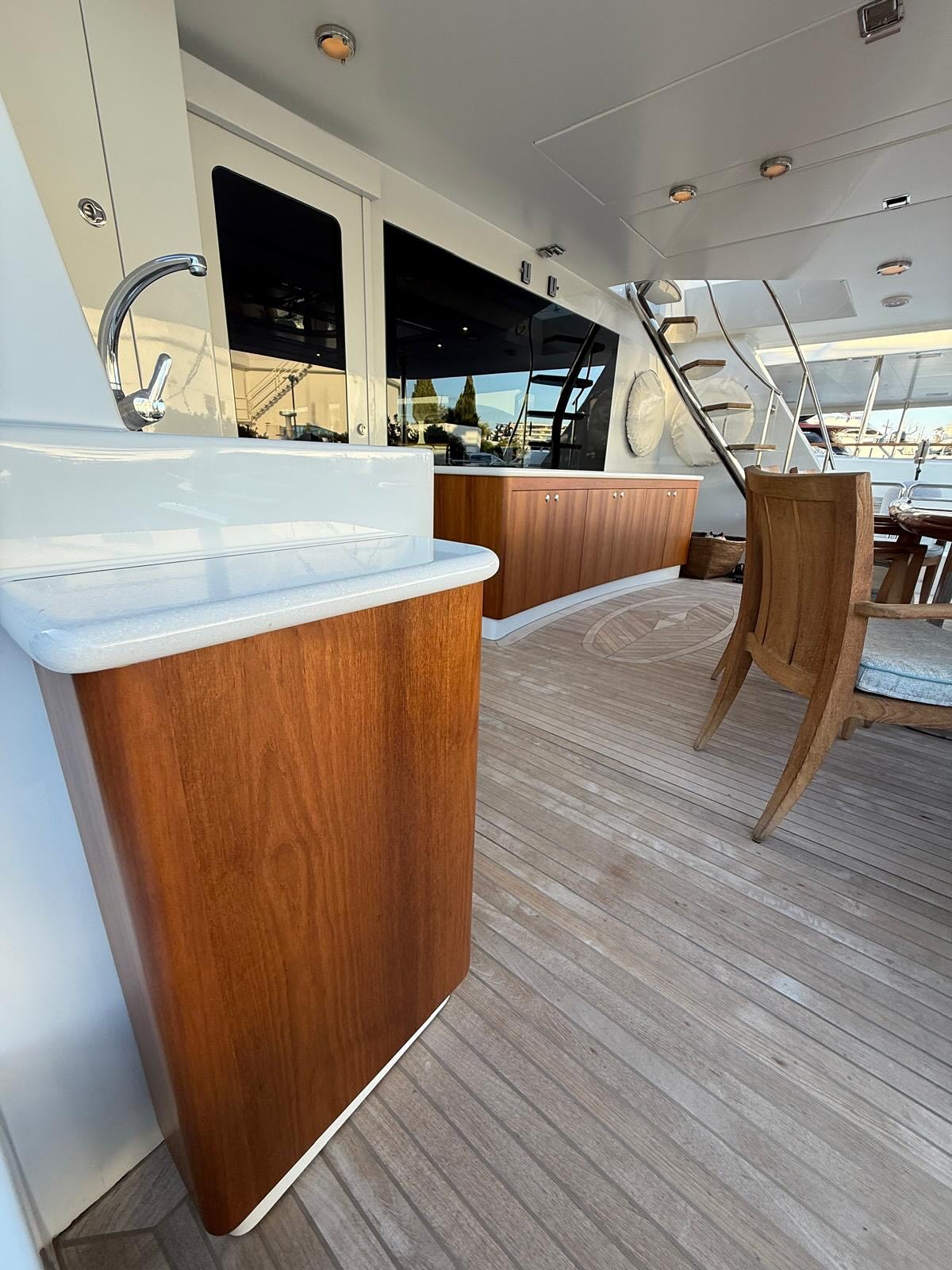 Custom teak cabinet with Corian top on a motor yacht aft deck