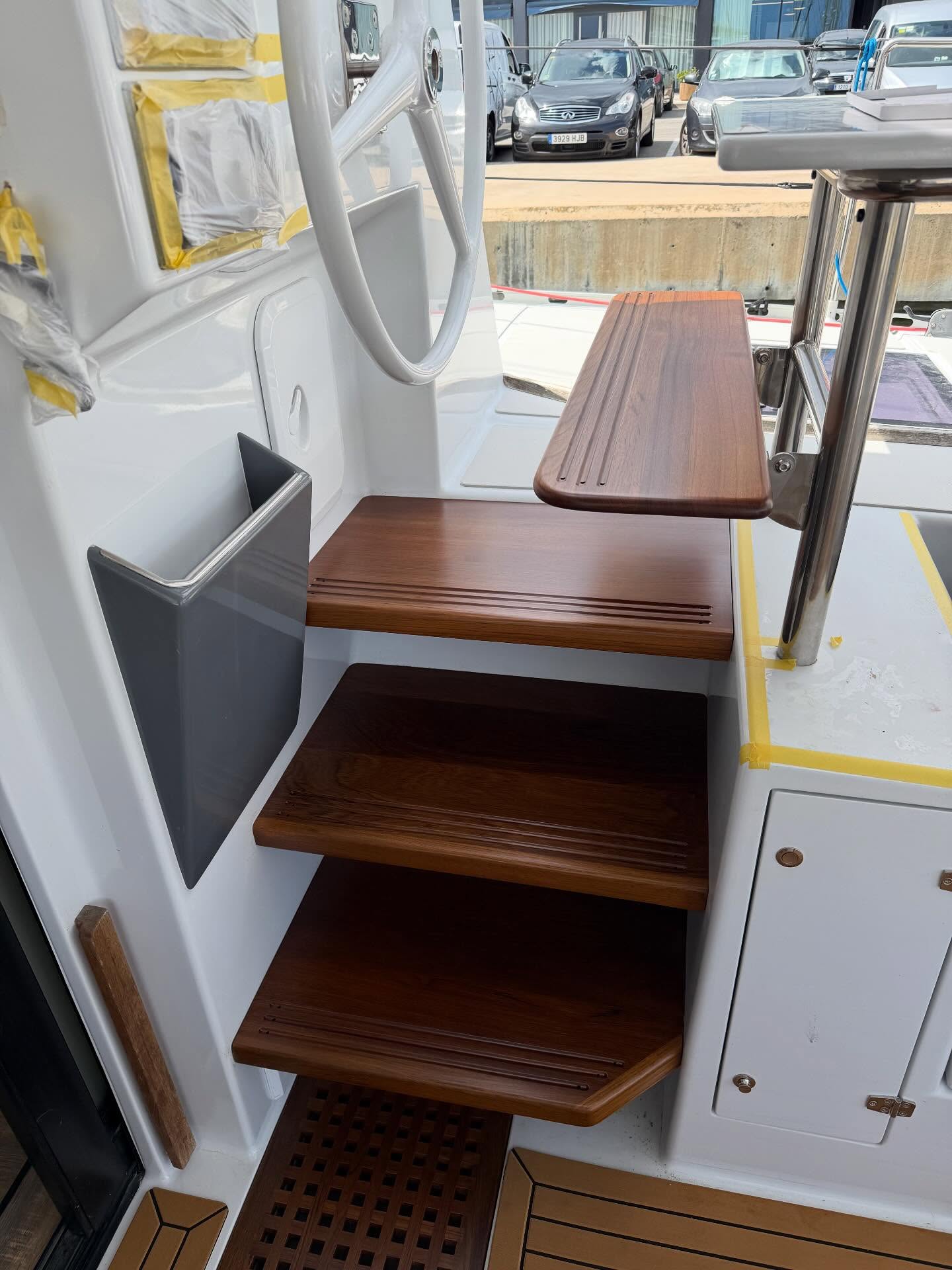 Restored varnished teak steps aboard a yacht